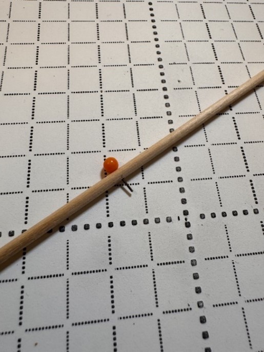 Figure: Detail of a pin through a wooden stick